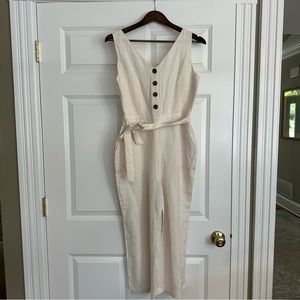NWOT, never been worn Off-white Loft jumpsuit with tortoise shell buttons